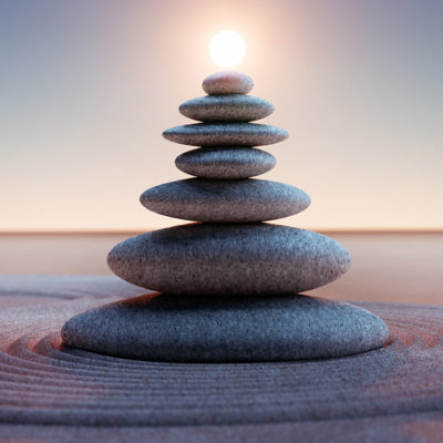 Stacked rocks with the sun behind on sand. You can get anxiety treatment in St. Petersburg, FL or therapy for anxiety in St. Petersburg, FL here. Your anxiety treatment can be local to St. Pete with a caring anxiety therapist here!