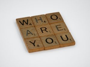 Scrabble tiles spelling out "WHO ARE YOU" in a square. You can feel belonging with individual therapy in St. Petersburg, FL here. Get online therapy in Florida with a skilled anxiety therapist in St. Pete. 