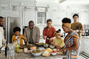 Family Eating around a kitchen table during the holidays can be stressful. Counseling saint petersburg, fl can help you set healthy boundaries with family. Meet with a St. Petersburg therapist via online therapy in Florida here!