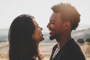 Couple staring at each other in the eyes and smiling. These relationship tips from a St. Pete couples therapist can help you!