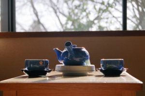 Tea service on a table near a window. Grief and loss are difficult and anxiety-inducing for loved ones. Get help with relationship counseling near St. Petersburg, FL or via online therapy in Florida here.