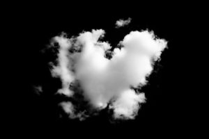 Cloud heart in the dark sky. Supporting a loved one through grief can be difficult. Get help with relationship counseling near St. Petersburg, FL or via online therapy in Florida here.