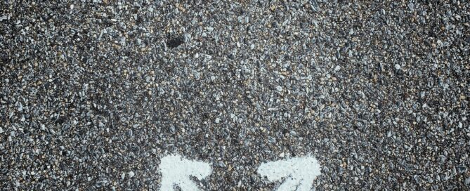 Black Shoes on street with arrows pointing different directions: Uncertainty